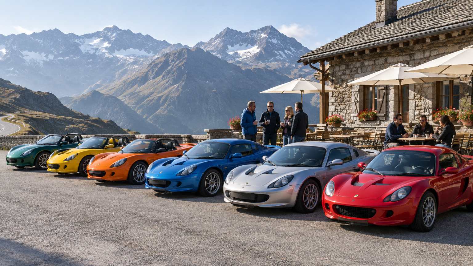 A row of sports cars parked outside a mountain cafe