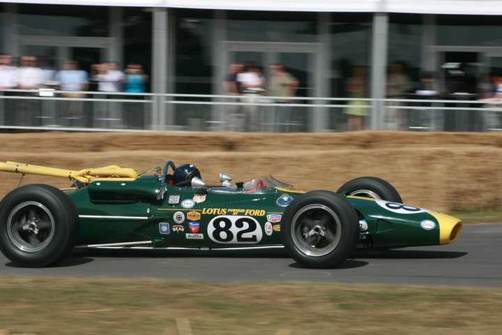 A green and yellow Lotus 38 on the hill at the Goodwood Festival of Speed