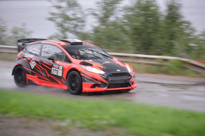 A rally car at speed on a wet stage of Targa Newfoundland
