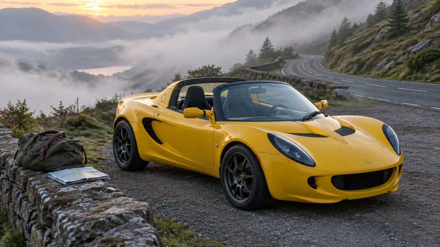A yellow roadster parked at a mountain lay-by at dawn with a soft bag and a road map on the wall beside it