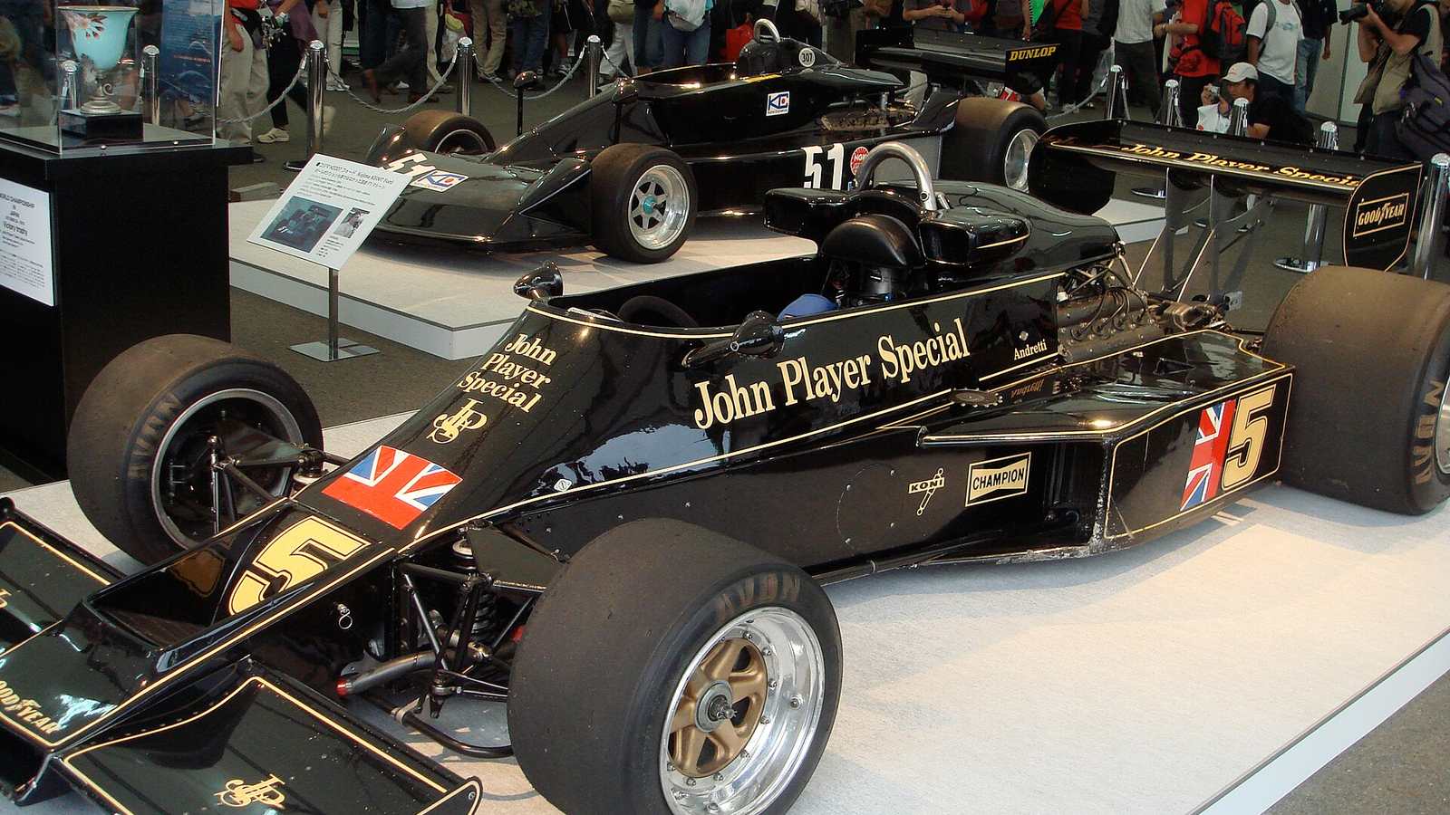 Mario Andretti's black and gold John Player Special Lotus 77, number 5, on display at an exhibition in Japan