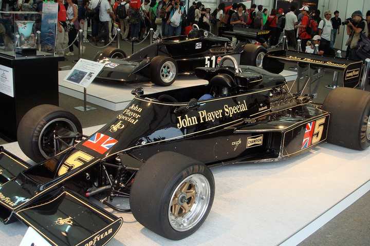 Mario Andretti's black and gold John Player Special Lotus 77, number 5, on display at an exhibition in Japan