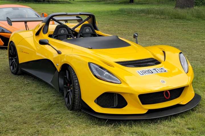 A yellow Lotus 3-Eleven at an outdoor show
