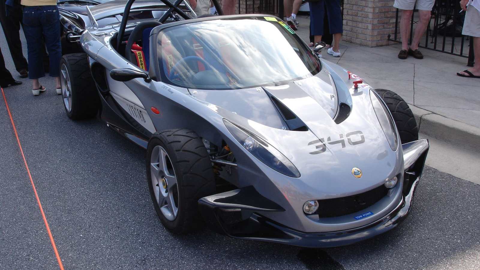 A silver Lotus 340R with exposed wheels and no roof