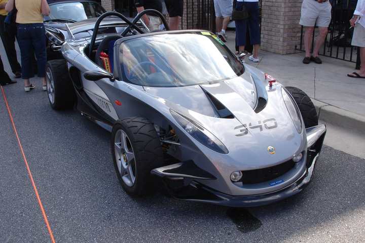 A silver Lotus 340R with exposed wheels and no roof