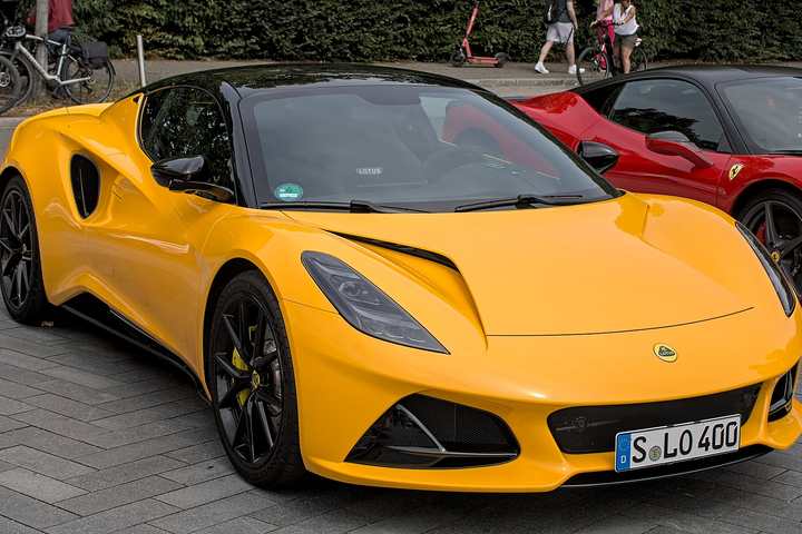 A yellow Lotus Emira coupé