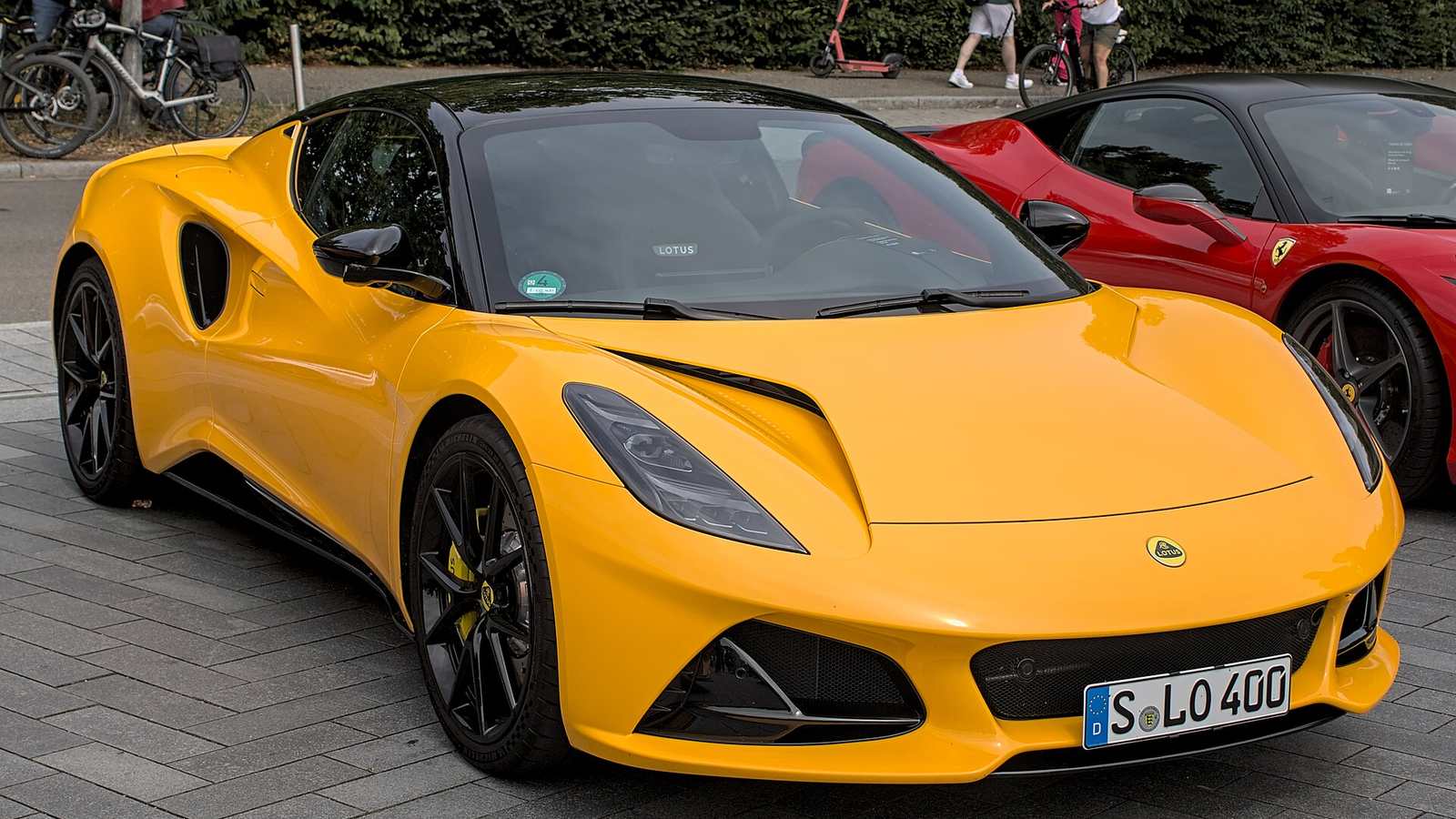 A yellow Lotus Emira coupé