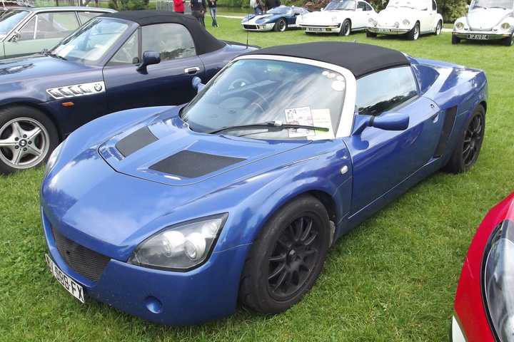 A blue Vauxhall VX220 roadster