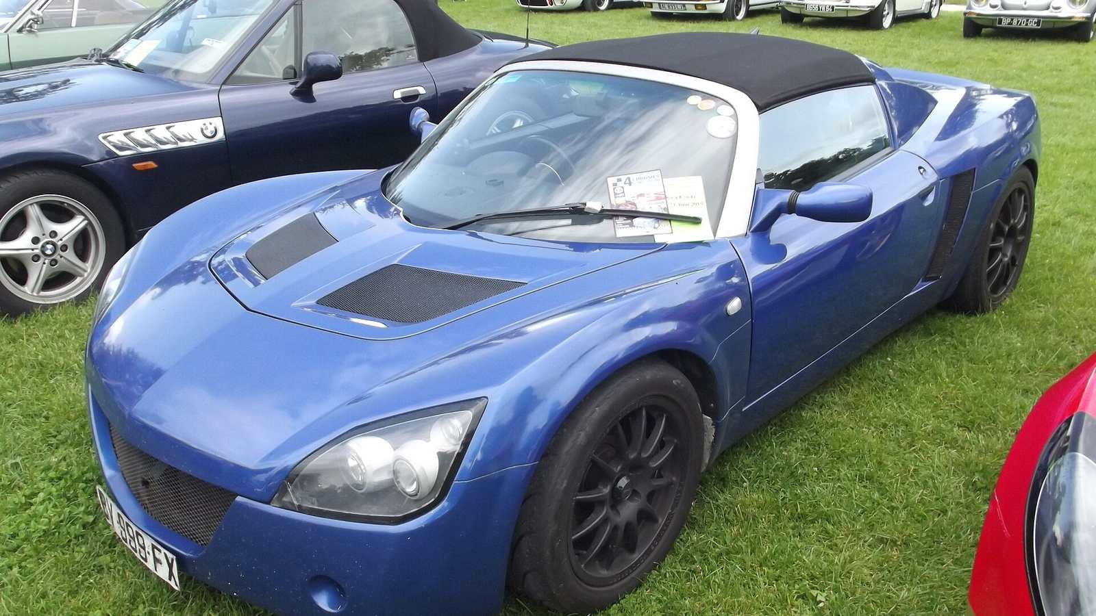 A blue Vauxhall VX220 roadster