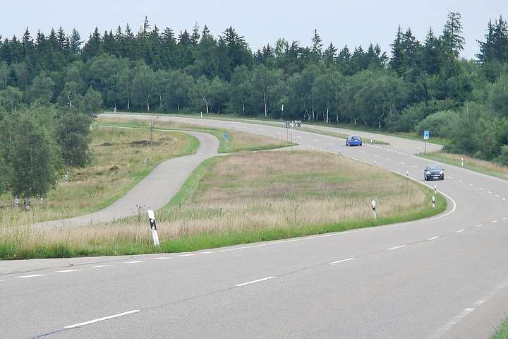 A sweeping bend on the B500 Black Forest High Road through open forest