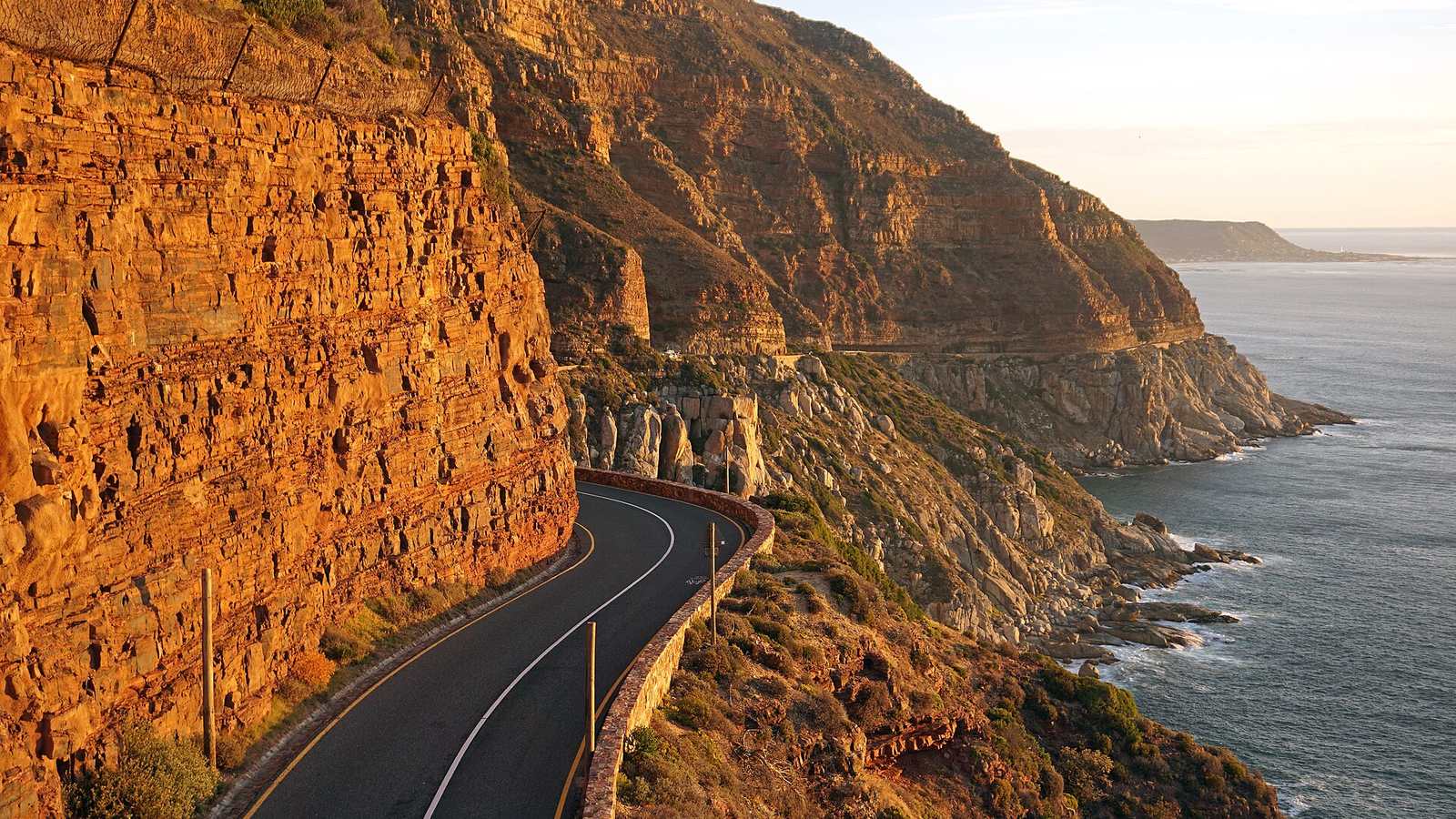 Chapman's Peak Drive cut into red cliffs above the Atlantic Ocean