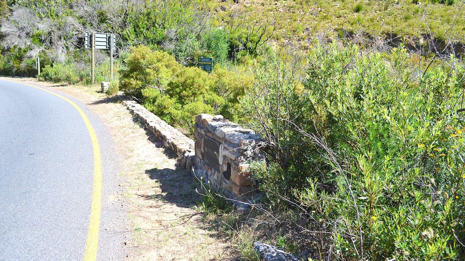 The road over Franschhoek Pass curving through fynbos-covered mountains