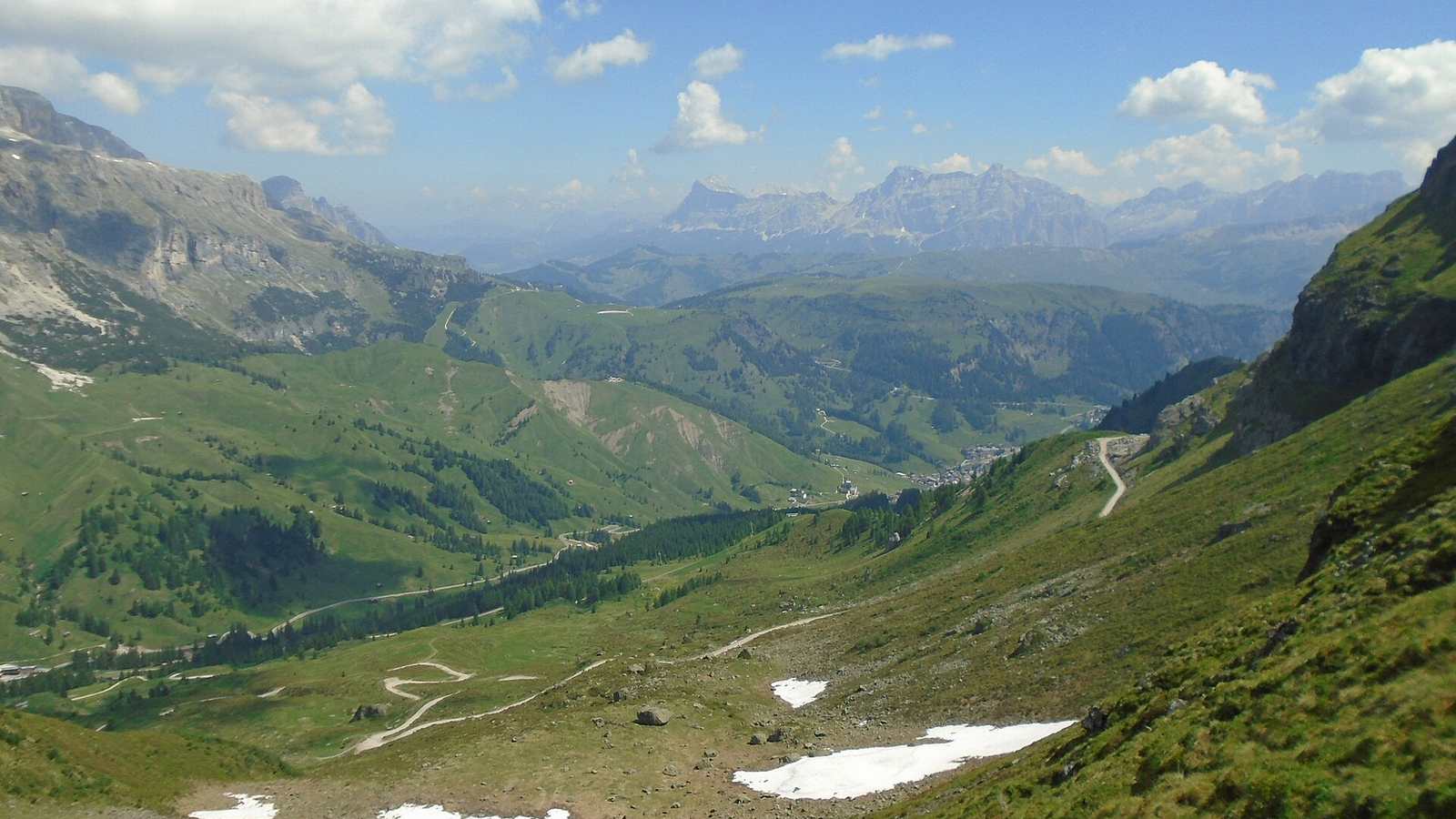 The Great Dolomites Road between Arabba and the Pordoi Pass with Dolomite peaks beyond
