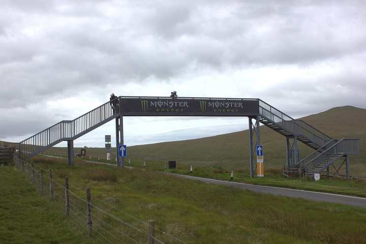 The A18 Mountain Road passing under the footbridge at the Bungalow on the TT course