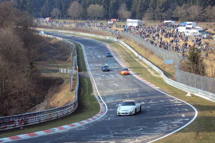 Cars lapping the Nürburgring Nordschleife at Brünnchen during a public session
