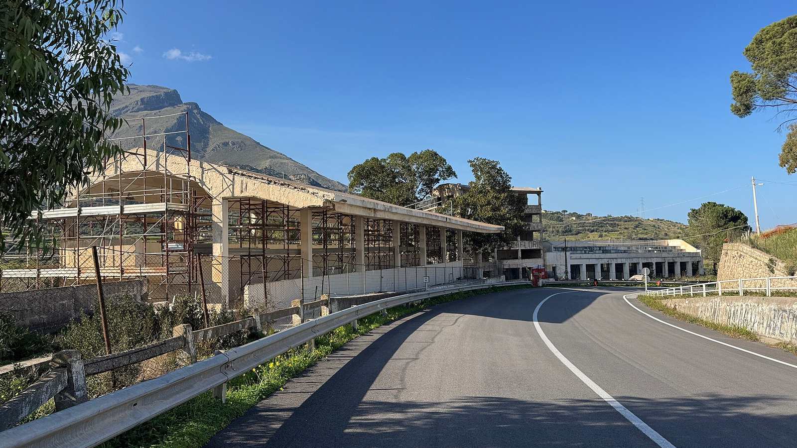 The old Targa Florio pit buildings and grandstands at Floriopoli beside the public road