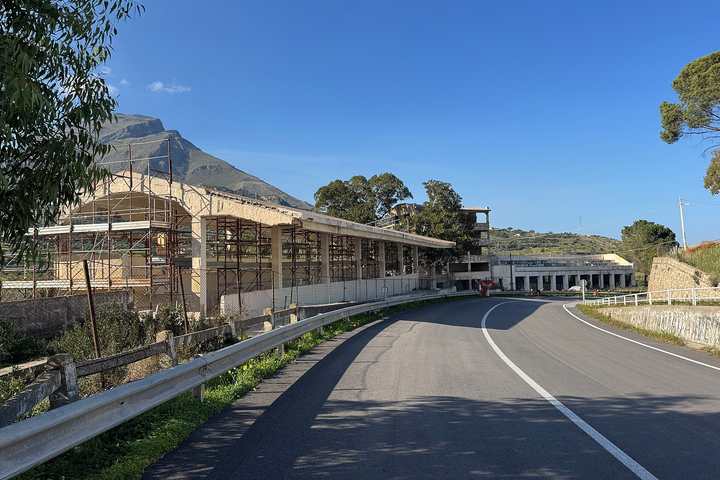 The old Targa Florio pit buildings and grandstands at Floriopoli beside the public road