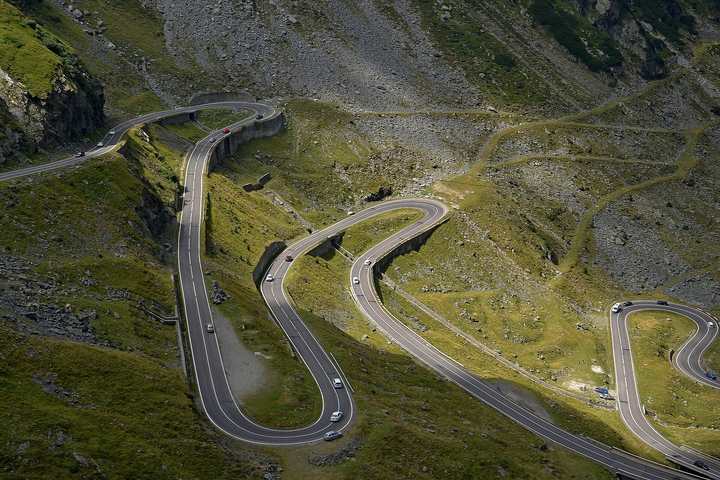 The Transfăgărășan road looping across the upper Bâlea valley in Romania